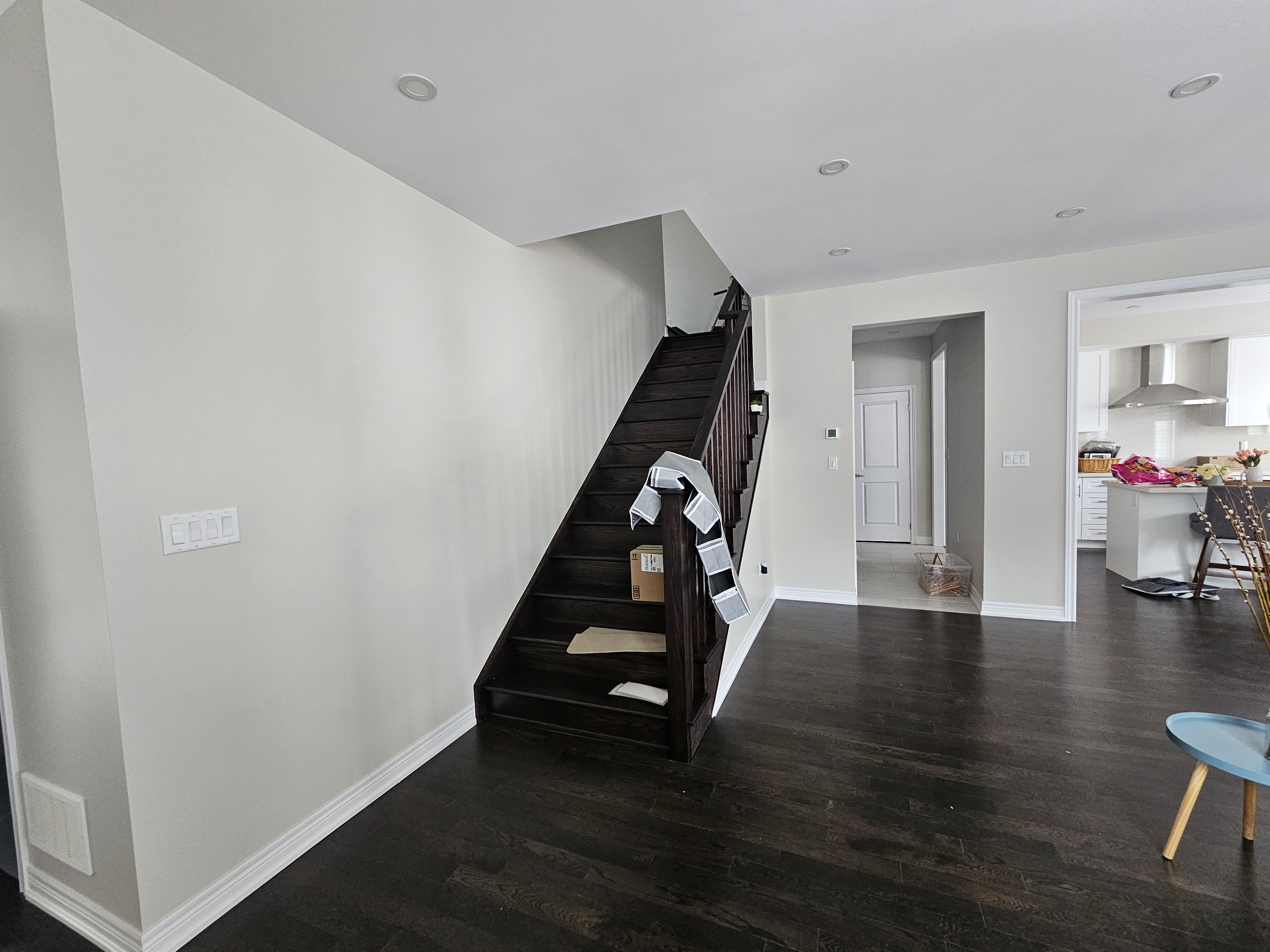 this interior paint job highlights the stairwell and livingroom which are both painted in balboa mist