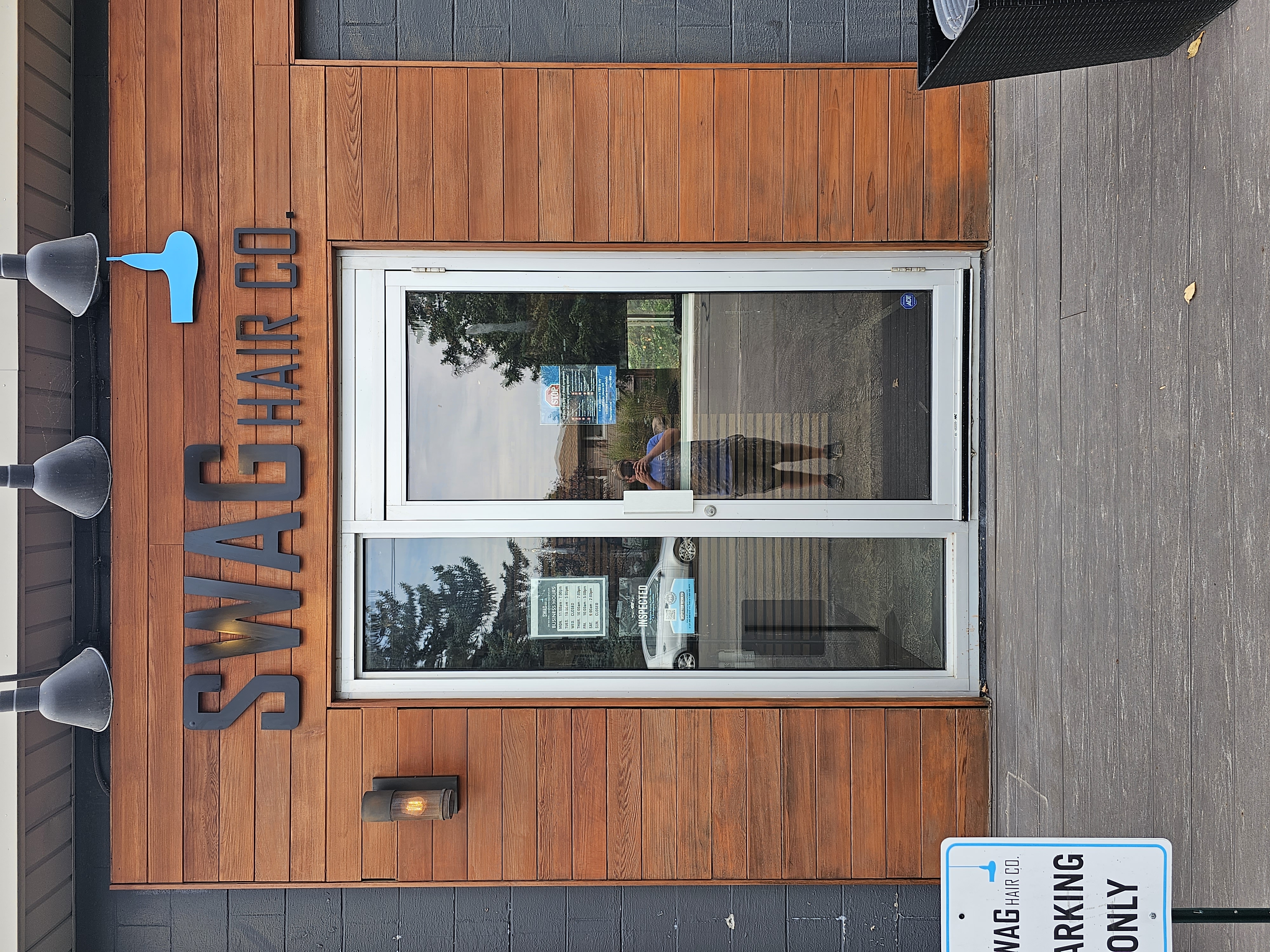 newly stained wood around the exterior door of a commercial property