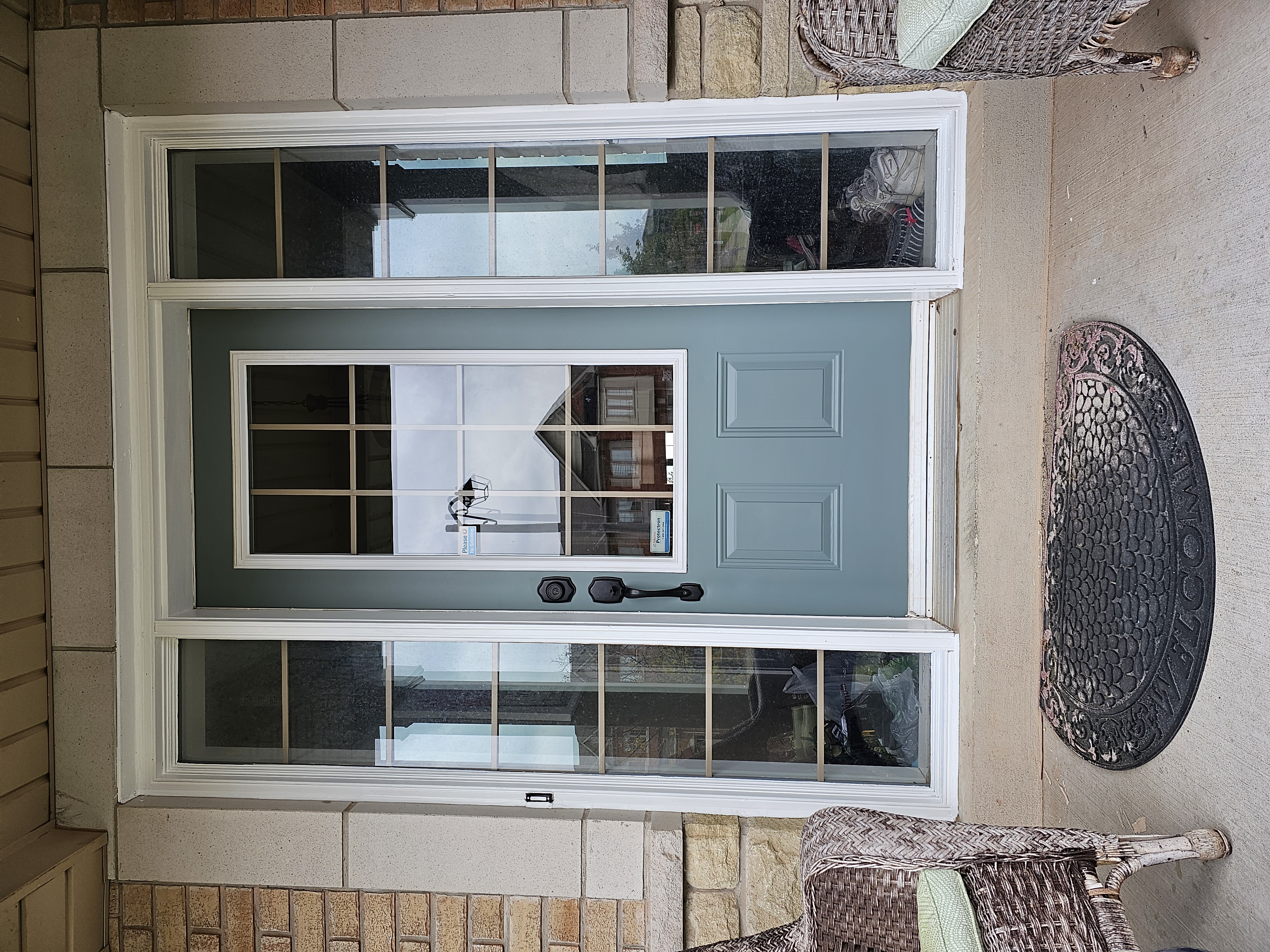 freshly painted exterior door in a blue/gary