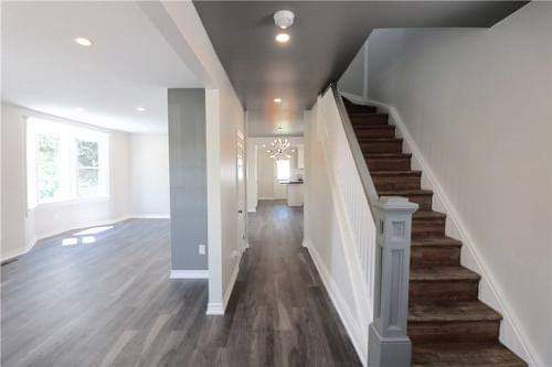 freshy painted entry way with agray ceiling accentsith white walls